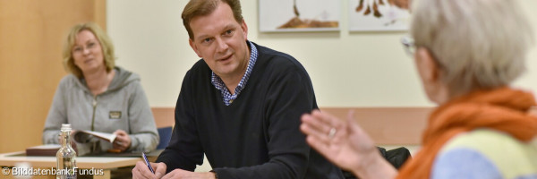Drei Personen von der ehrenamtlichen Redaktion